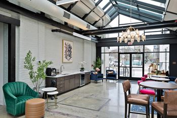 Community lounge with kitchenette and seating areas 1
